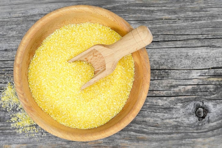 Top view of cornmeal in wooden bowl