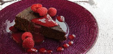 Flourless Chocolate Date Cake with Raspberry Coulis