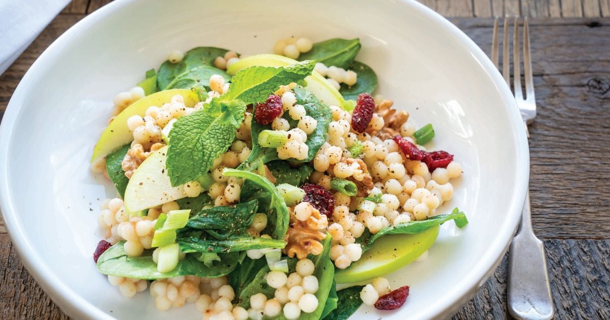 Warm Pearl Couscous Bowl with Spinach, Apple, Walnuts, and Tahini