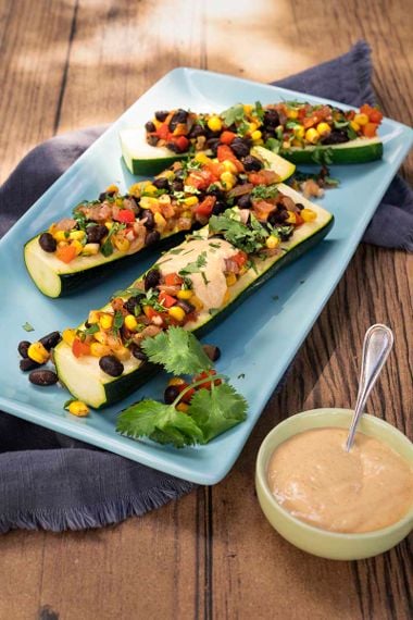 Bean Stuffed Zucchini with Cheesy Sauce