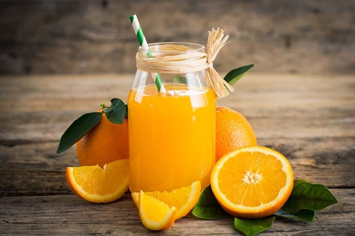 Fresh orange juice in the glass jar