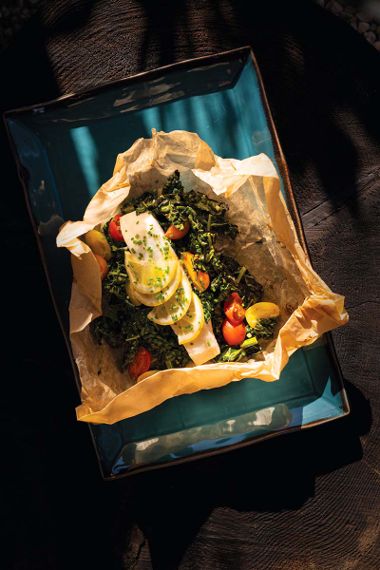 Steamed Pacific Halibut Packets with Kale, Grape Tomatoes, and Garlic Lemon Chili Oil