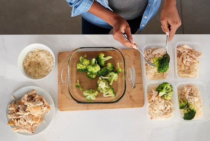 Overhead View Of Woman In Kitchen Preparing High Protein Meal